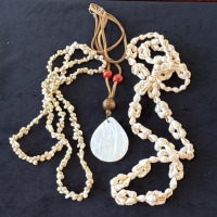 TWO SEASHELL NECKLACES AND A MOTHER OF PEARL PENDANT NECKLACE